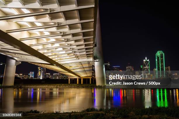 margaret hunt hill bridge and trinity river with reflection of office buildings, dallas, texas, usa - dallas margaret hunt hill bridge stock pictures, royalty-free photos & images