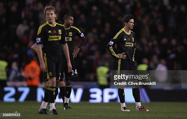 Fernando Torres,David Ngog and Lucas Leiva of Liverpool show their dejection after Stoke have scored the second goal during the Barclays Premier...