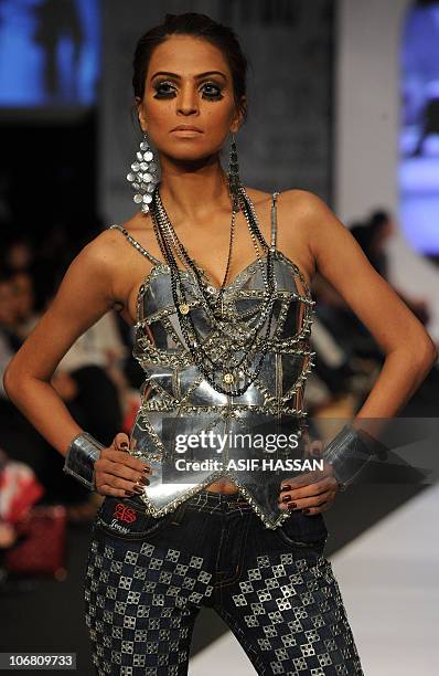 Model presents a creation by Pakistani designer Ammar Belal on the last day of the Pakistan Fashion Design Council Sunsilk Fashion Week in Karachi on...