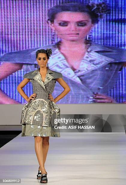 Model presents a creation by Pakistani designer Ammar Belal on the last day of the Pakistan Fashion Design Council Sunsilk Fashion Week in Karachi on...