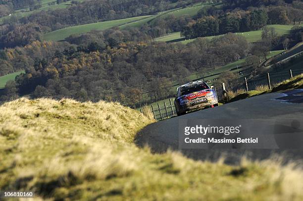Sebastien Loeb of France and Daniel Elena of Monaco compete in their Citroen C4 WRT during Leg 2 of the WRC Wales Rally GB on November 13, 2010 in...