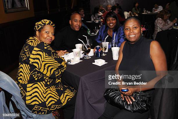 Wounder warrior and family pose during Microsoft and the USO's "A Salute To Our Troops" Wounded Warrior Luncheon at Hard Rock Cafe - Times Square on...