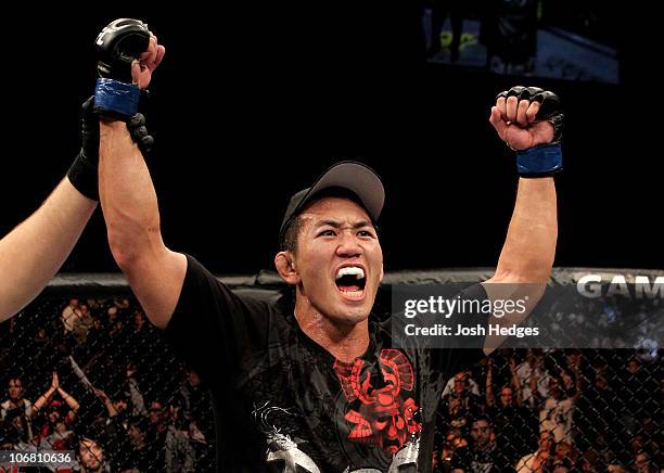 Yushin Okami of Japan celebrates his unanimous points victory over Nate Marquardt of the USA during their UFC Middleweight Championship Eliminator...