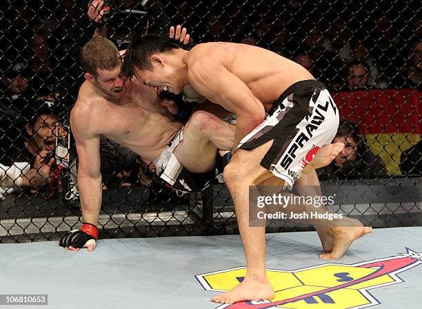 Nate Marquardt of the USA fights Yushin Okami of Japan during their UFC Middleweight Championship Eliminator bout at the Konig Pilsner Arena on...