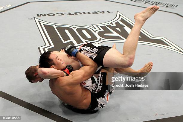 Nate Marquardt of the USA fights Yushin Okami of Japan during their UFC Middleweight Championship Eliminator bout at the Konig Pilsner Arena on...