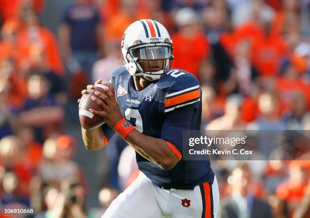 Quarterback Cameron Newton of the Auburn Tigers rolls out of the pocket against the Georgia Bulldogs at Jordan-Hare Stadium on November 13, 2010 in...