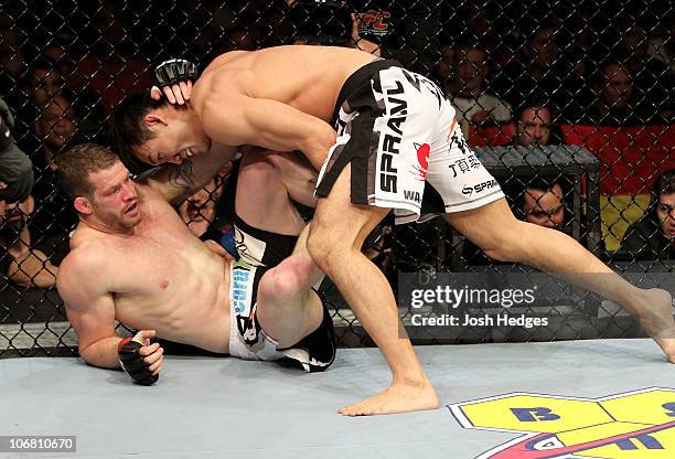 Nate Marquardt of the USA fights Yushin Okami of Japan during their UFC Middleweight Championship Eliminator bout at the Konig Pilsner Arena on...