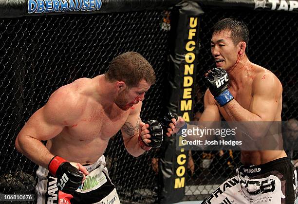 Nate Marquardt of the USA fights Yushin Okami of Japan during their UFC Middleweight Championship Eliminator bout at the Konig Pilsner Arena on...