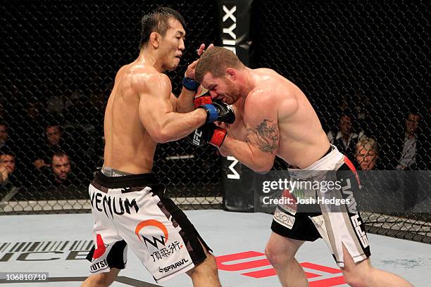 Nate Marquardt of the USA fights Yushin Okami of Japan during their UFC Middleweight Championship Eliminator bout at the Konig Pilsner Arena on...