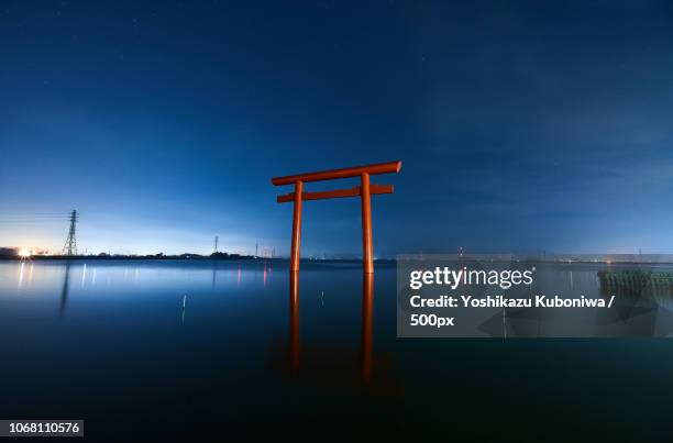 landscape with shinto shrine - shintoismus stock-fotos und bilder