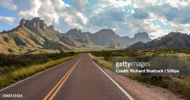 empty road in mountains - big bend national park stock pictures, royalty-free photos & images