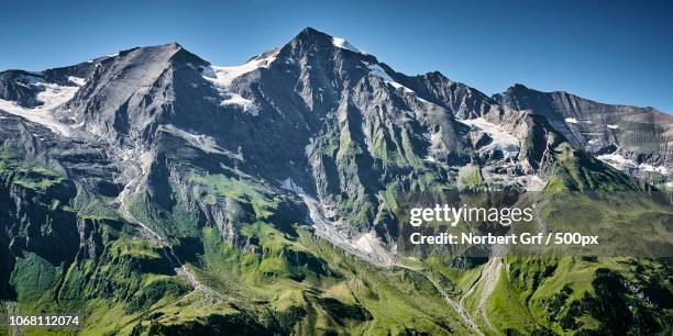 mountain landscape with grossglockner on sunny day, austria - grossglockner stock-fotos und bilder