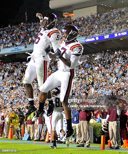 Quarterback Tyrod Taylor and Marcus Davis of the Virginia Tech Hokies celebrate after connecting for a touchdown against the North Carolina Tar Heels...