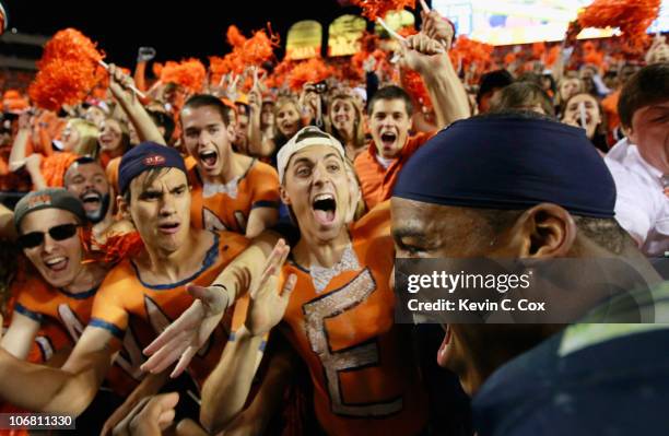 Quarterback Cameron Newton of the Auburn Tigers celebrates with fans after their 49-31 win over the Georgia Bulldogs at Jordan-Hare Stadium on...