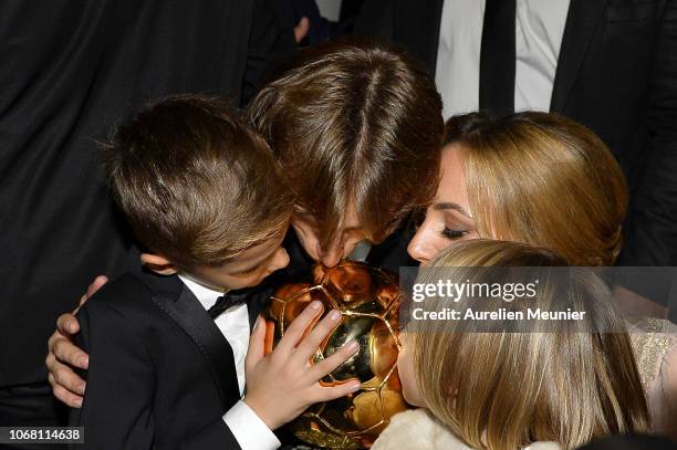 Luka Modric of Croatia and Real Madrid kiss the trophy with his wife Vanja Bosnic and their children Ivano and Ema after winning the 2018 Ballon D'Or...