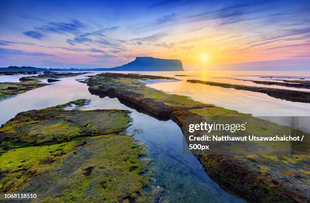 scenic sunset over seascape - jeju island stock pictures, royalty-free photos & images