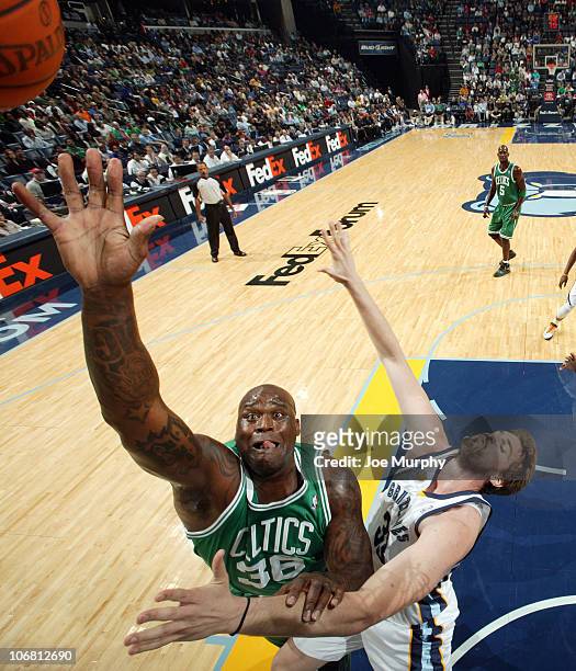 Shaquille O'Neal of the Boston Celtics rebounds against Marc Gasol of the Memphis Grizzlies on November 13, 2010 at FedExForum in Memphis, Tennessee....