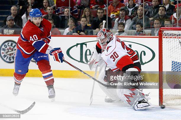 Maxim Lapierre of the Montreal Canadiens scores a goal on Cam Ward of the Carolina Hurricanes during the NHL game at the Bell Centre on November 13,...