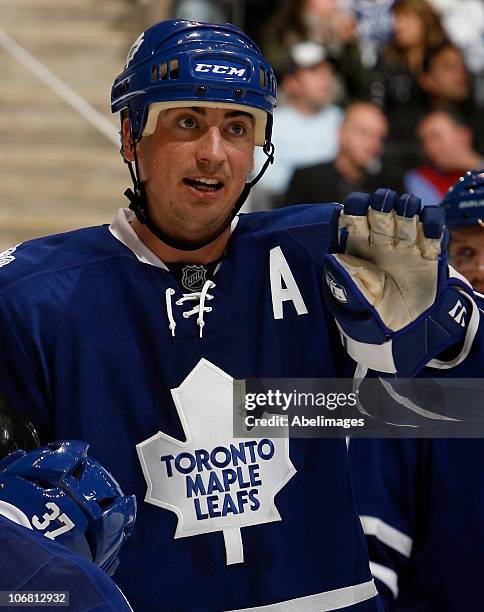 Tomas Kaberle of the Toronto Maple Leafs gestures to his partner during game action against the Vancouver Canucks at the Air Canada Centre November...