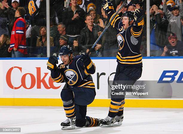 Thomas Vanek of the Buffalo Sabres celebrates his game-winning overtime goal with teammate Jordan Leopold for a 3-2 win over the Washington Capitals...