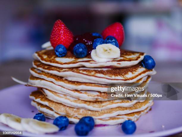 close-up of pancakes with fruit - blueberry pancakes stock pictures, royalty-free photos & images