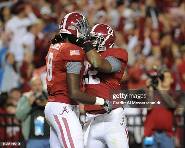 Wide receiver Julio Jones of the Alabama Crimson Tide celebrates a 56 yard touchdown with running back Mark Ingram against the Mississippi State...