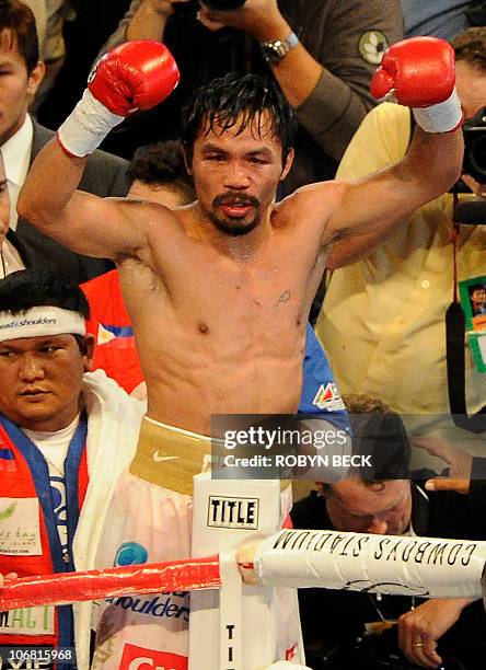 Manny Pacquiao of the Philippines celebrates after defeating Antonio Margarito of Mexico in their WBC World Super Welterweight title fight, at...