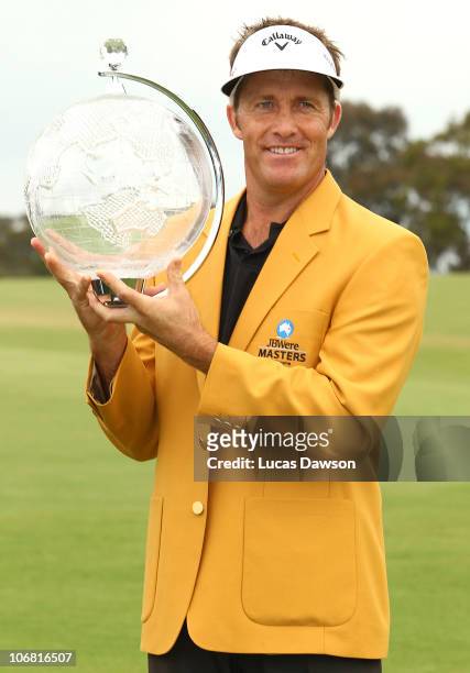 Stuart Appleby of Australia holds the trophy after winning the 2010 Australia Masters after round four of the Australian Masters at The Victoria Golf...