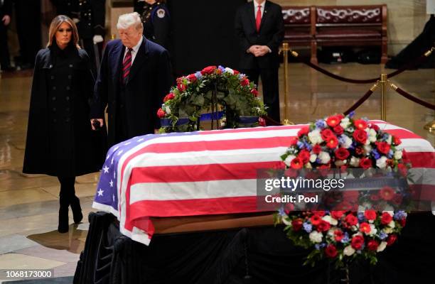 President Donald Trump and first lady Melania Trump arrive to pay their respects to former U.S. President George H.W. Bush at the U.S Capitol Rotunda...