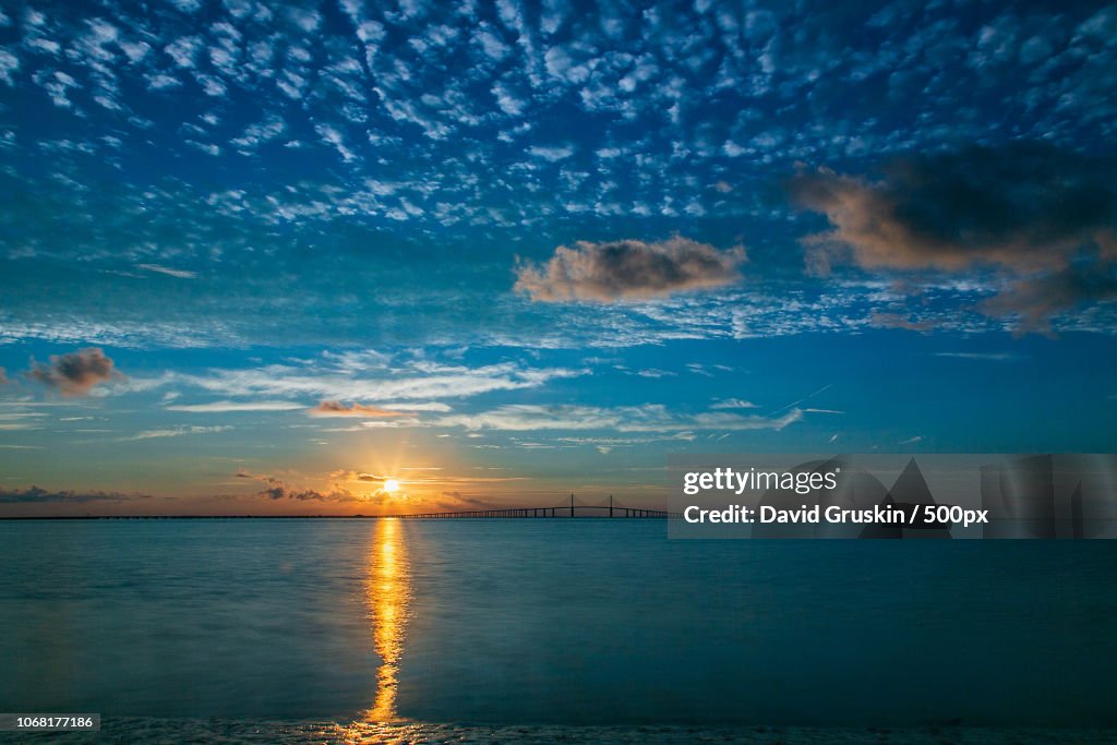 Sunset and moody sky over sea