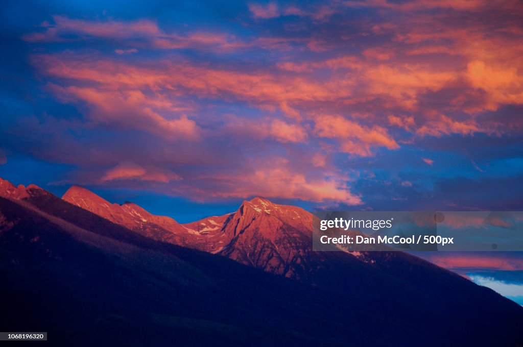 Scenic view of mountain peak at sunset