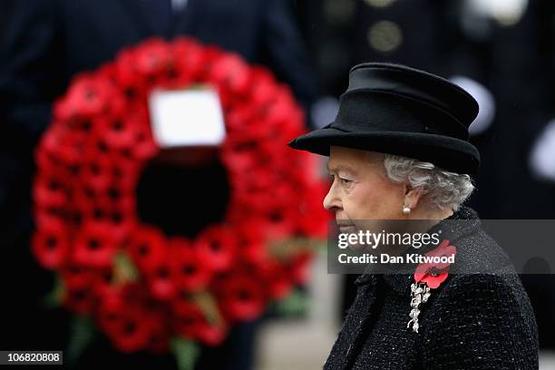 Queen Elizabeth II waits to lay a wreath at the Cenotaph during Remembrance Sunday in Whitehall, on November 14, 2010 in London, England. Remembrance...