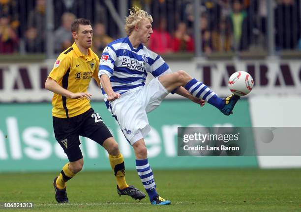 Manuel Junglas of Aachen challenges Julian Koch of Duisburg during the Second Bundesliga match between Alemannia Aachen and MSV Duisburg at Tivoli...