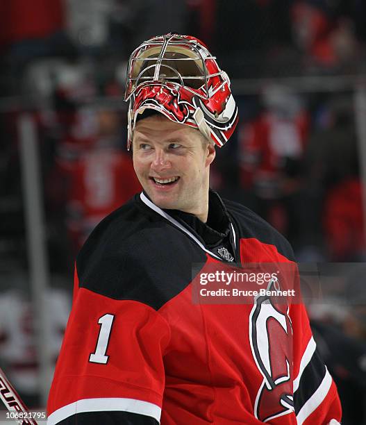 Johan Hedberg of the New Jersey Devils skates against the Buffalo Sabres at the Prudential Center on November 10, 2010 in Newark, New Jersey. The...