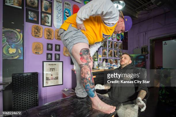 Getting ready for another tattoo, Rob Gaskins of Belton, talks with tattoo artist Jeremy Taylor during his visit Wednesday to Skin Quest Tattoos in...