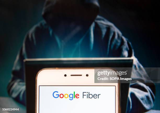 In this photo illustration, the Fast Internet service provider by Google, Google Fiber, logo is seen displayed on an Android mobile device with a...