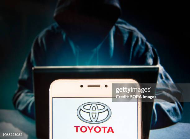 In this photo illustration, the Japanese multinational automobile manufacturer Toyota Motor logo is seen displayed on an Android mobile device with a...