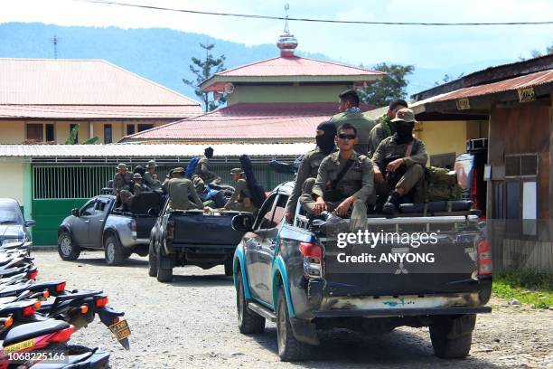 Indonesian Mobile Brigade Police head to Nduga, where 31 construction workers are believed to have been shot dead, from Wamena on December 4, 2018. -...