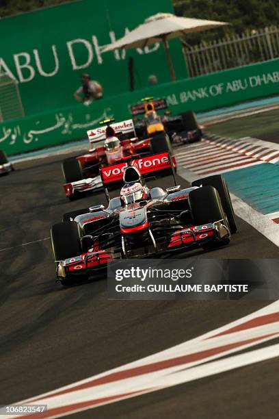 McLaren Mercedes' British driver Jenson Button drives at the Yas Marina circuit on November 14, 2010 in Abu Dhabi, during the Abu Dhabi Formula One...