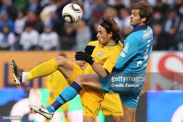 Nicolas Lombaerts of FC Zenit St. Petersburg battles for the ball with Igor Lebedenko of FC Rostov Rostov-on-Don during the Russian Football League...