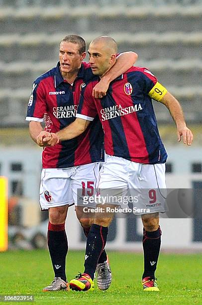 Marco Di Vaio of Bologna celebrates with team mate Diego Perez after scoring a goal during the Serie A match between Bologna and Brescia at Stadio...