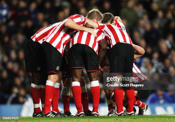 Nedum Onuoha of Sunderland is mobbed by team mates as he scores their first goal during the Barclays Premier League match between Chelsea and...