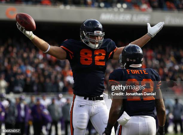 Greg Olsen of the Chicago Bears celebrates a touchdown catch with teammate Matt Forte against the Minnesota Vikings at Soldier Field on November 14,...