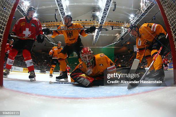 Dennis Endras, goalie of Germany saves the puck during the German Ice Hockey Cup 2010 third round game between Germany and Switzerland at...