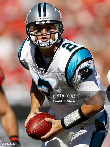 Quarterback Jimmy Clausen of the Carolina Panthers looks to hand the ball off against the Tampa Bay Buccaneers during the game at Raymond James...