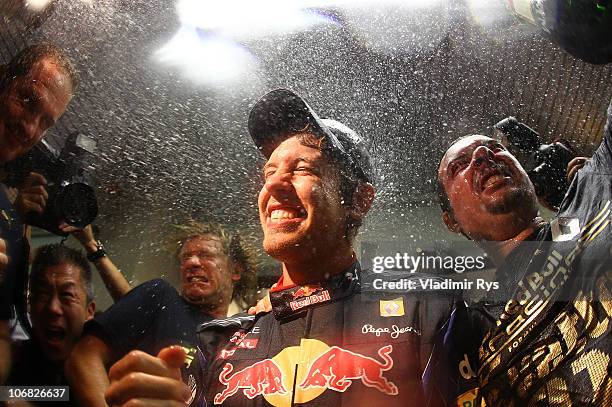 Sebastian Vettel of Germany and Red Bull Racing celebrates with his team after winning the driver's championship during the Abu Dhabi Formula One...