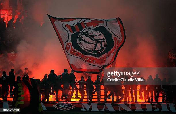 Fans of AC Milan show their support during the Serie A match between FC Inter and AC Milan at Stadio Giuseppe Meazza on November 14, 2010 in Milan,...