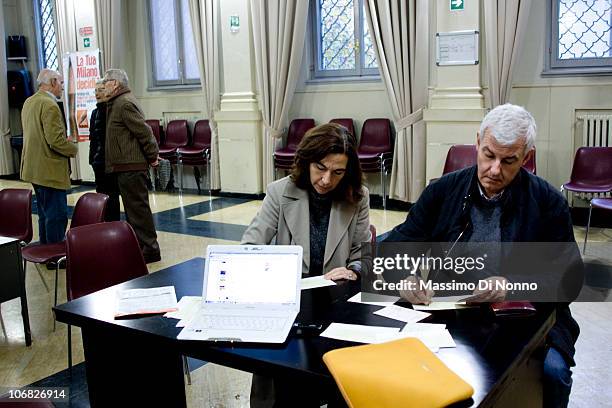 Alessandro Profumo, former CEO of Unicredit SpA, and his wife vote at the PD party primary to select a candidate for the 2011 Milan mayoral elections...