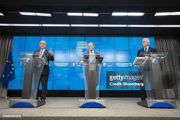 Jean-Claude Juncker, president of the European Commission, left, speaks as Donald Tusk, president of the European Union , center, and Michel Barnier,...