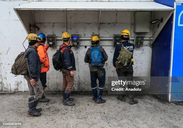 Miners enter the lignite coal mine after dressing for mining in their personal closets at the quarry in Soma district of Manisa, which is the most...